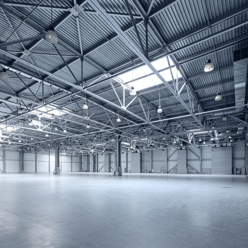 Newly decorated empty grey manufacturing warehouse.