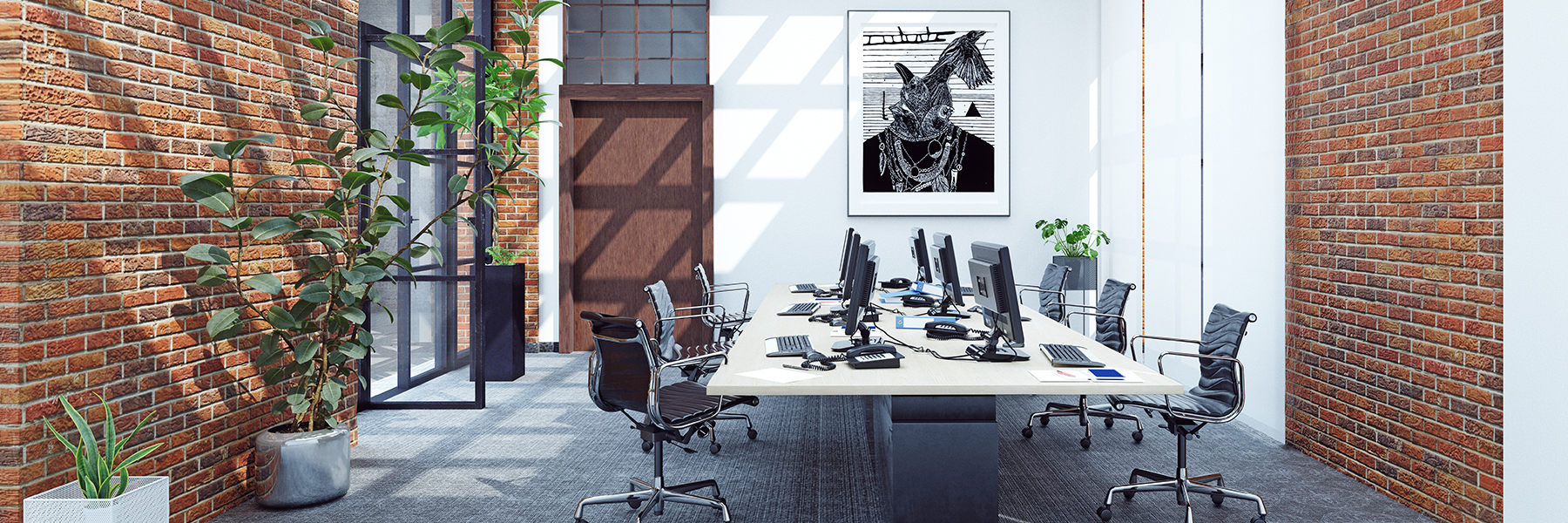 Internal of luxury office with brick feature walls and modern desks with monitors and desk chairs.