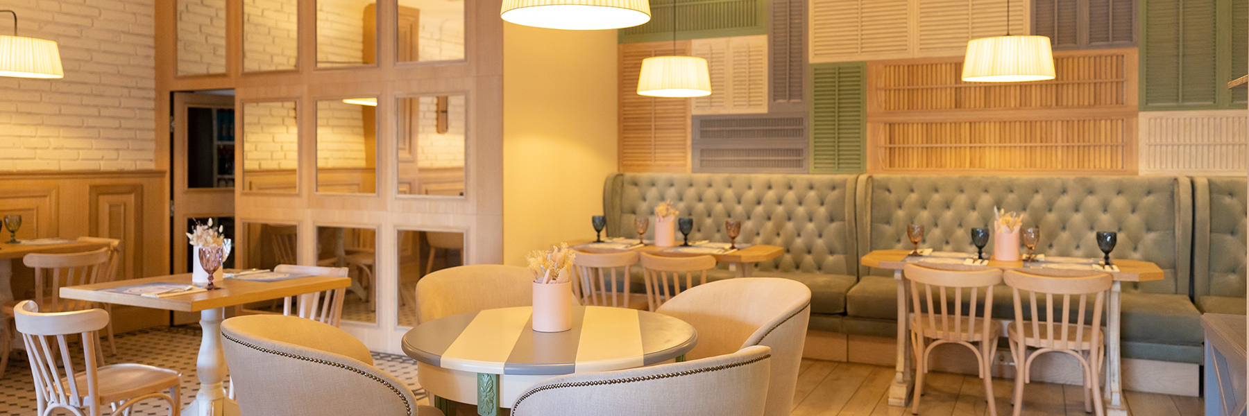 Internal of empty luxury restaurant with ambient lighting and pastel colours.